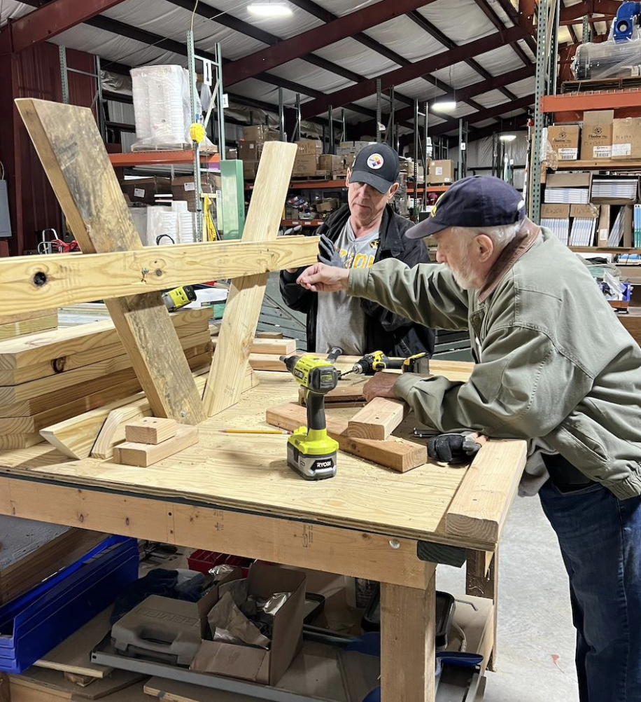 Over the hill gang at Ferncliff building and delivering picnic tables